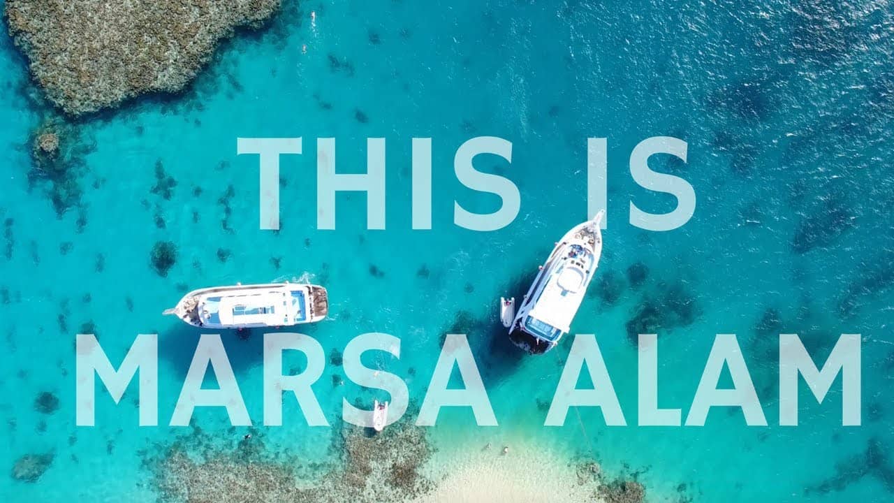 Aerial view of diving boats in turquoise water